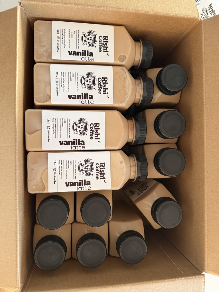 A box packed with labeled bottles, seen from above