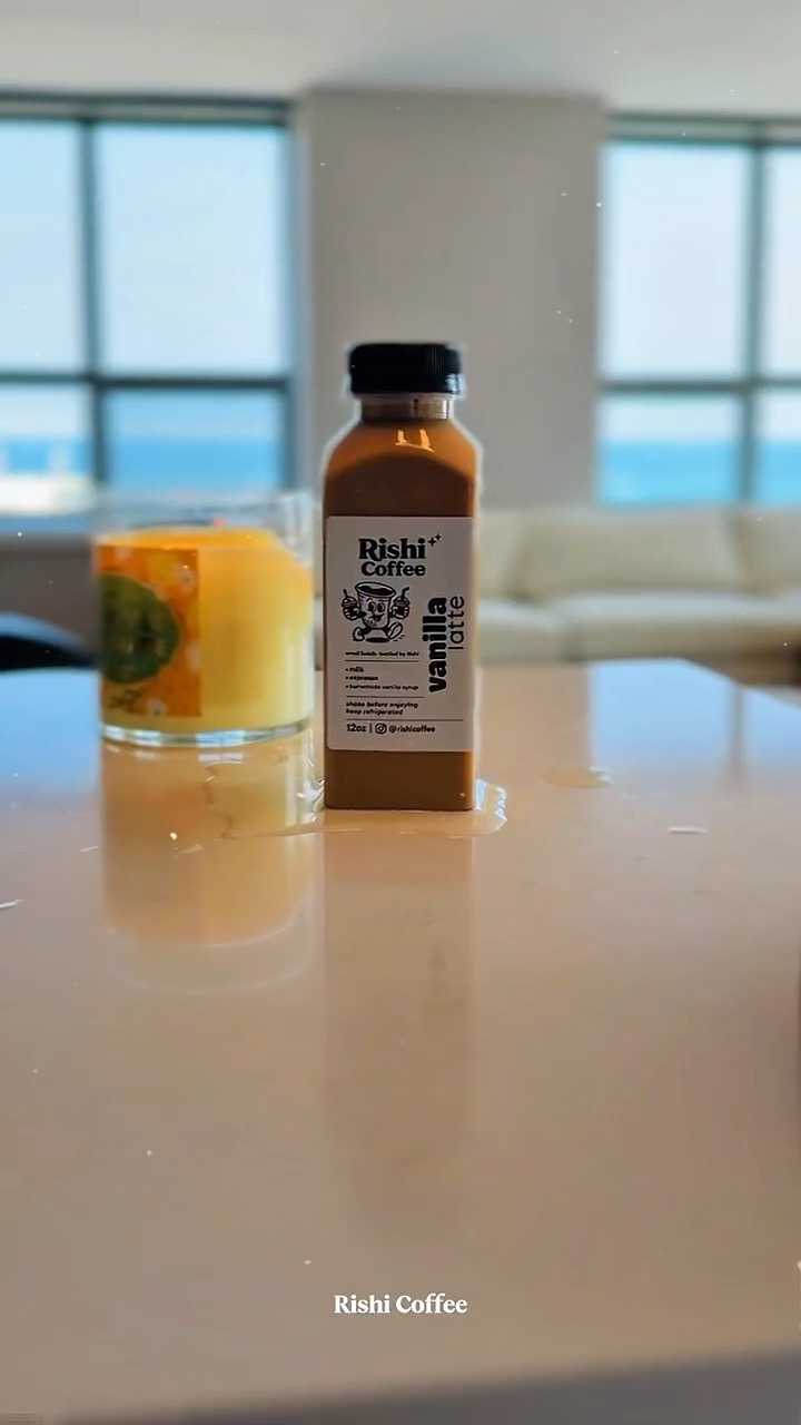 Rishi Coffee bottle on a counter with the lake behind it
